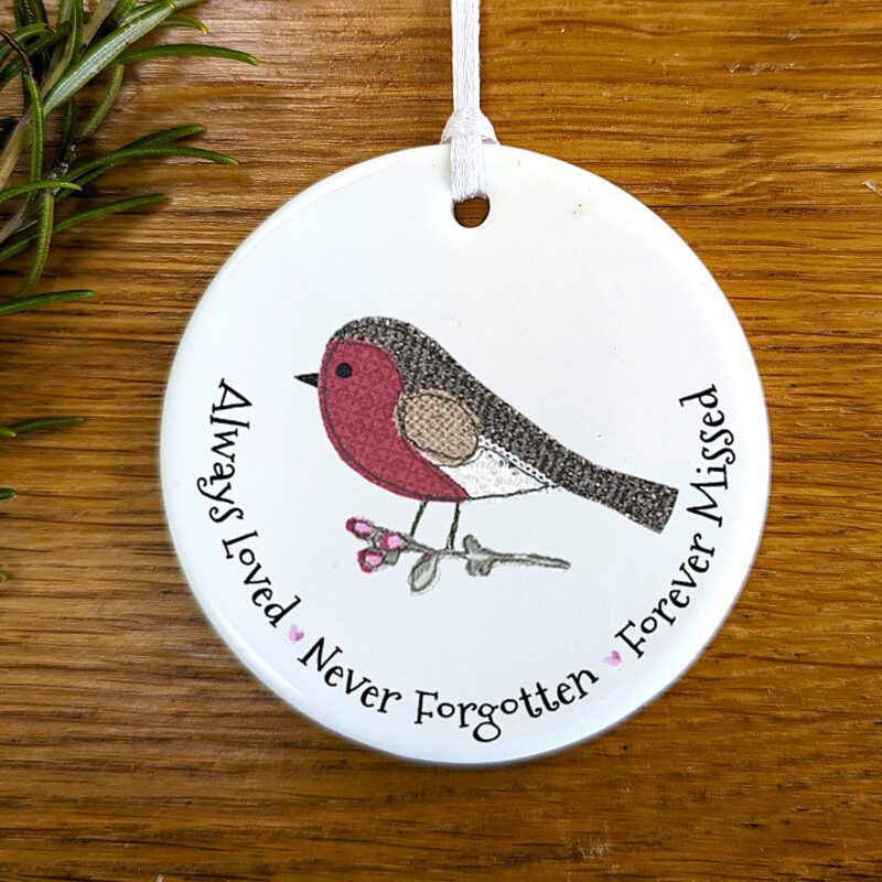 ceramic memorial hanging decoration with robin and quote Always loved, never forgotten, forever missed”.